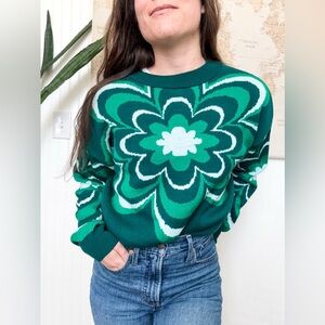 Green cropped long sleeve sweater with 70’s floral pattern design